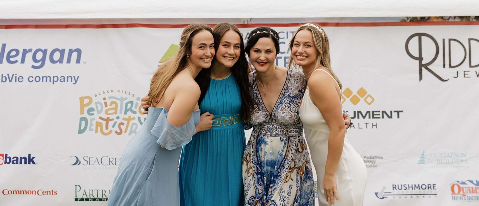 Four women at an event