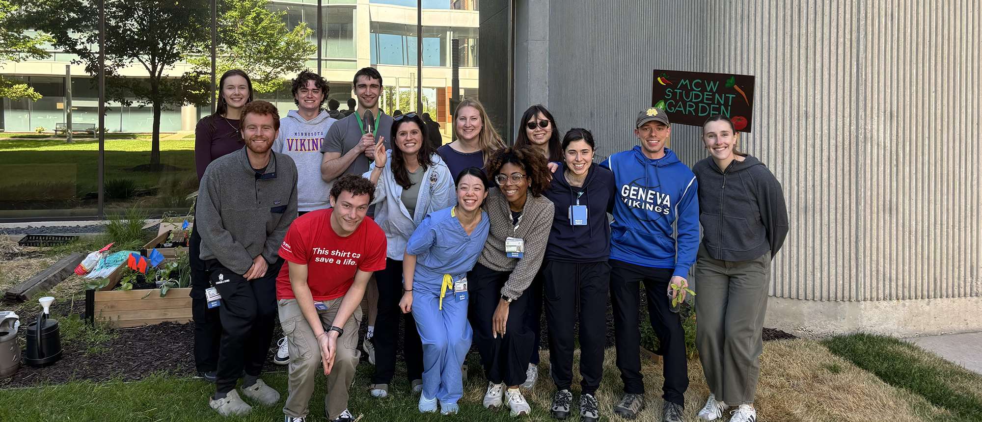 MCW medical students pose in front of garden