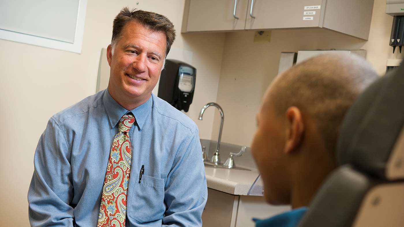 Dr. Joseph Kerschner with patient, 2014